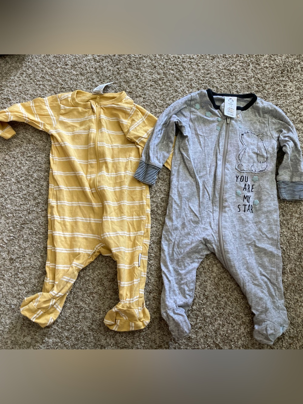 Two one-piece zipper footed pajamas